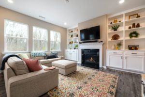 A Cozy Living Room with a Burning Fireplace